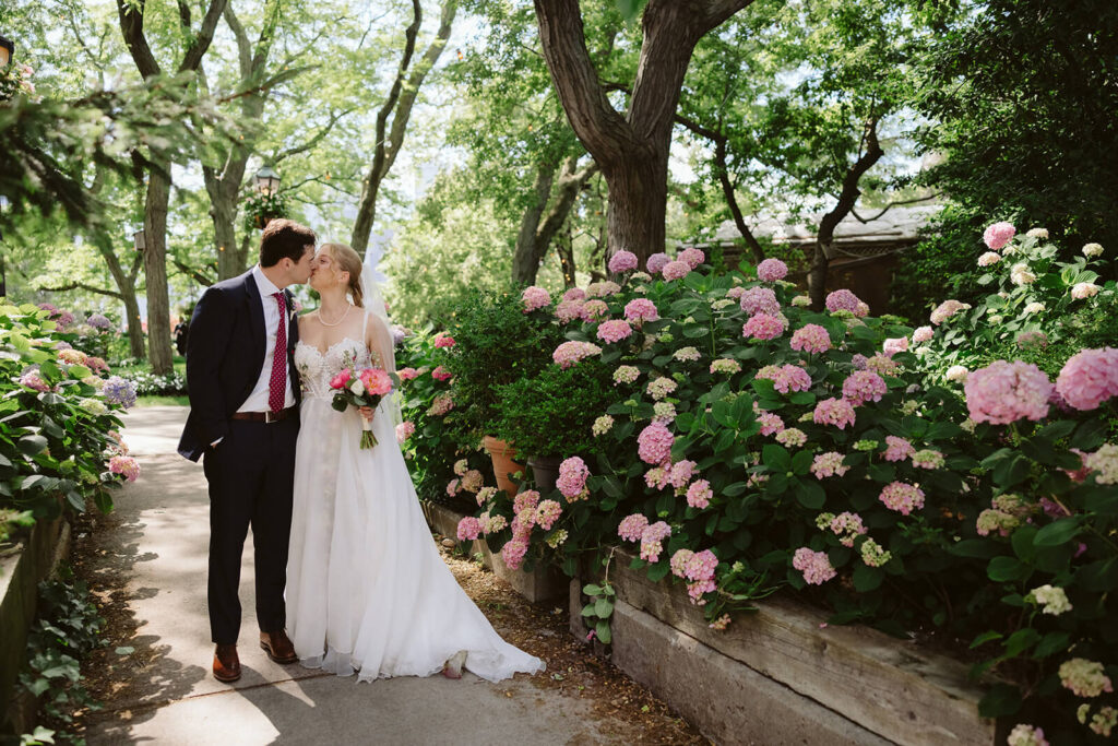 Bride and groom portraits along a  forested path in Brooklyn Bridge Park. Photo by OkCrowe Photography. 