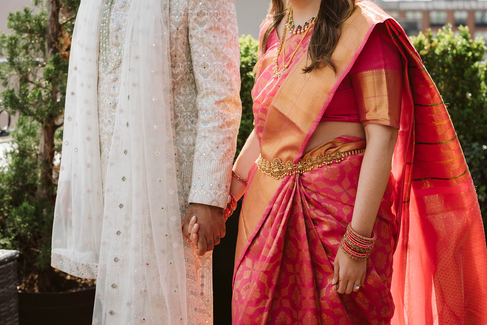 Newlywed portraits in traditional Hindu wedding garments on the rooftop of the Box House Hotel in Brooklyn. Photo by OkCrowe Photography.