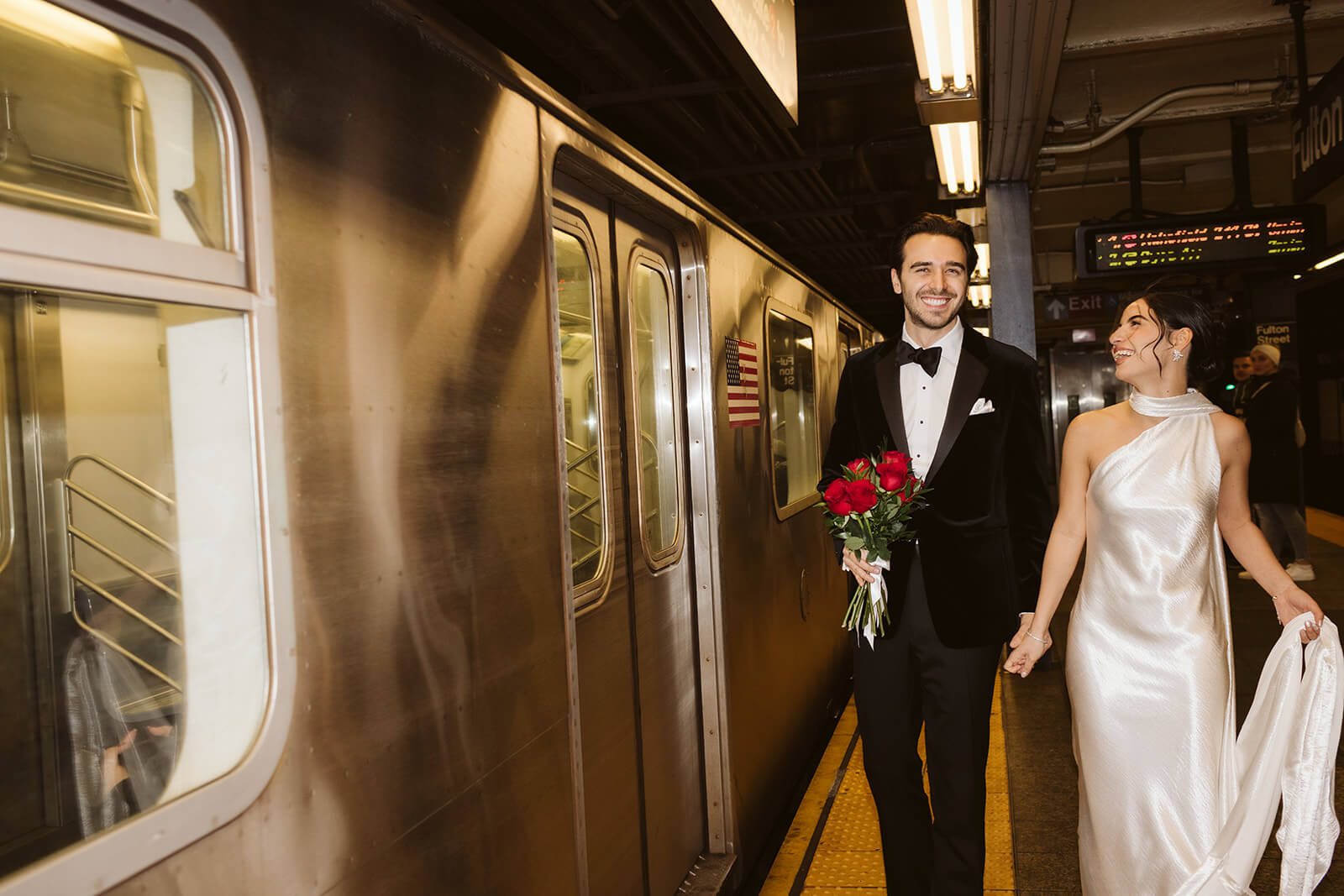 Bride and groom portraits in the NYC subway. Photo by OkCrowe Photography. 