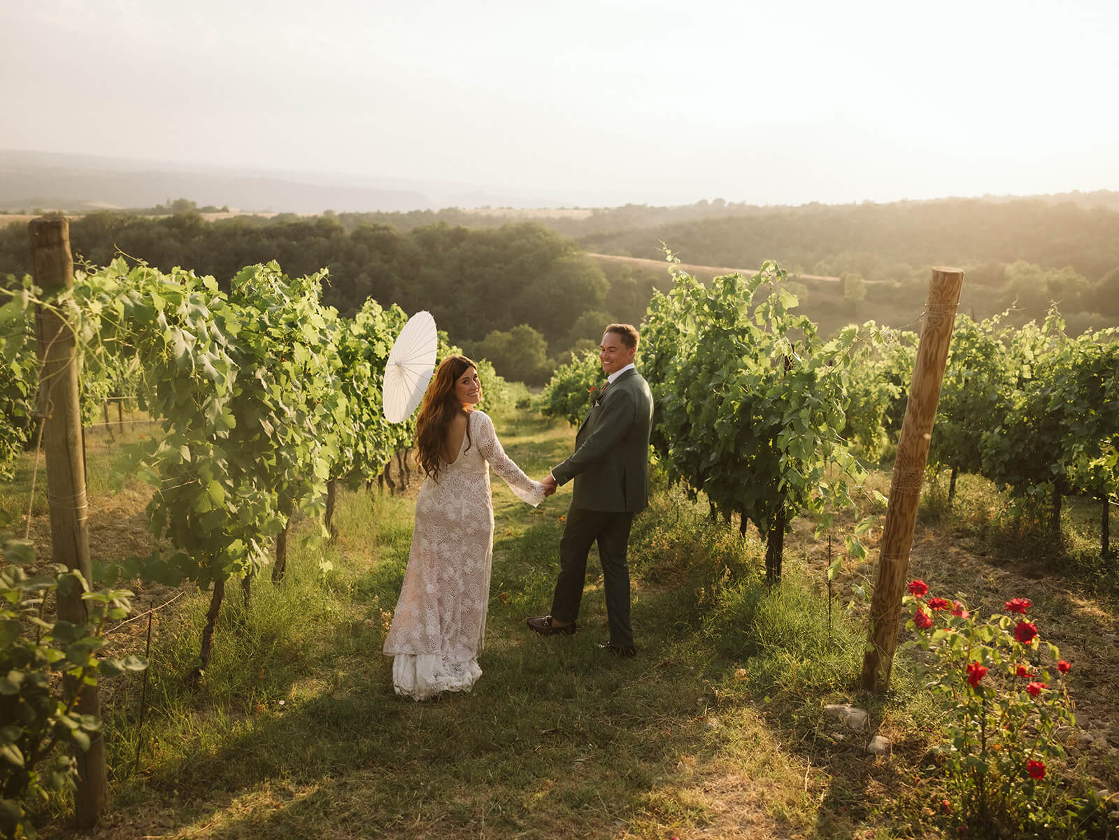 Golden hour newlywed potraits through the vineyards at Decugnano dei Barbi, Orvieto, Italy. Photo by OkCrowe Photography.