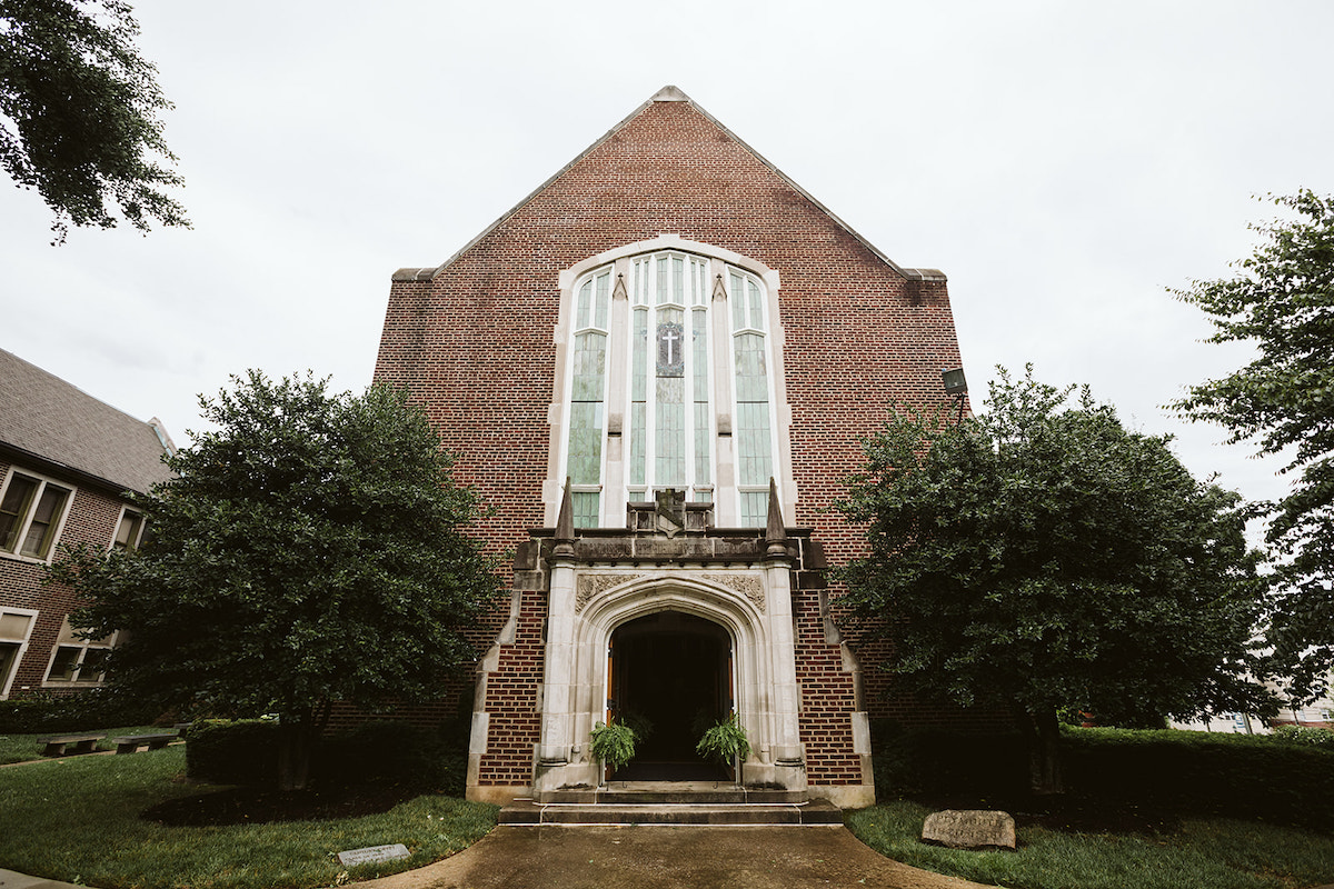 Brick facade and large, stained glass window over the front door of Patten Chapel on UTC's downtown Chattanooga campus