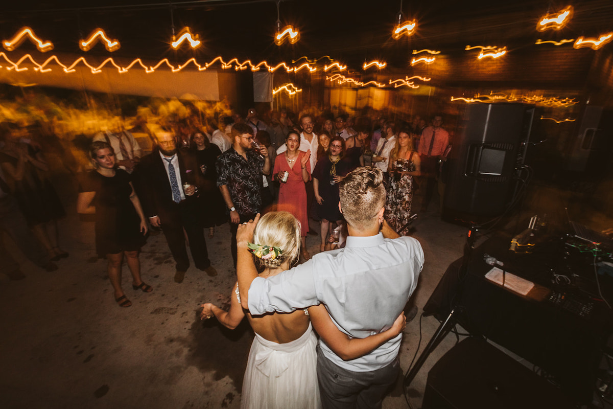 Bride and groom thank wedding guests at their reception on The Daily Ration patio