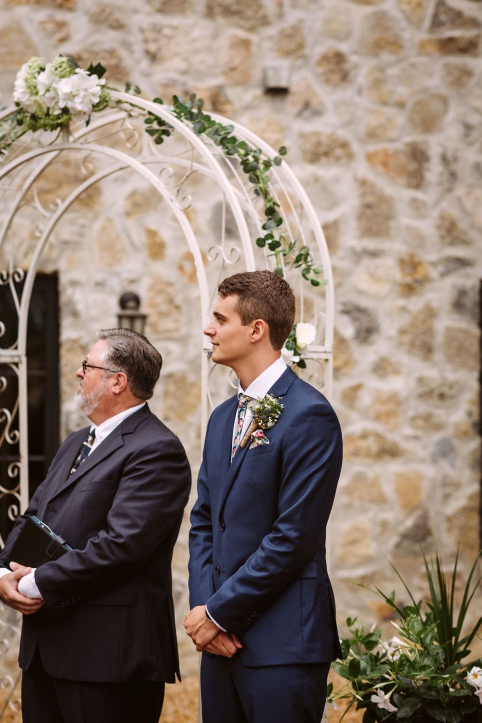 groom watching bride walk down aisle