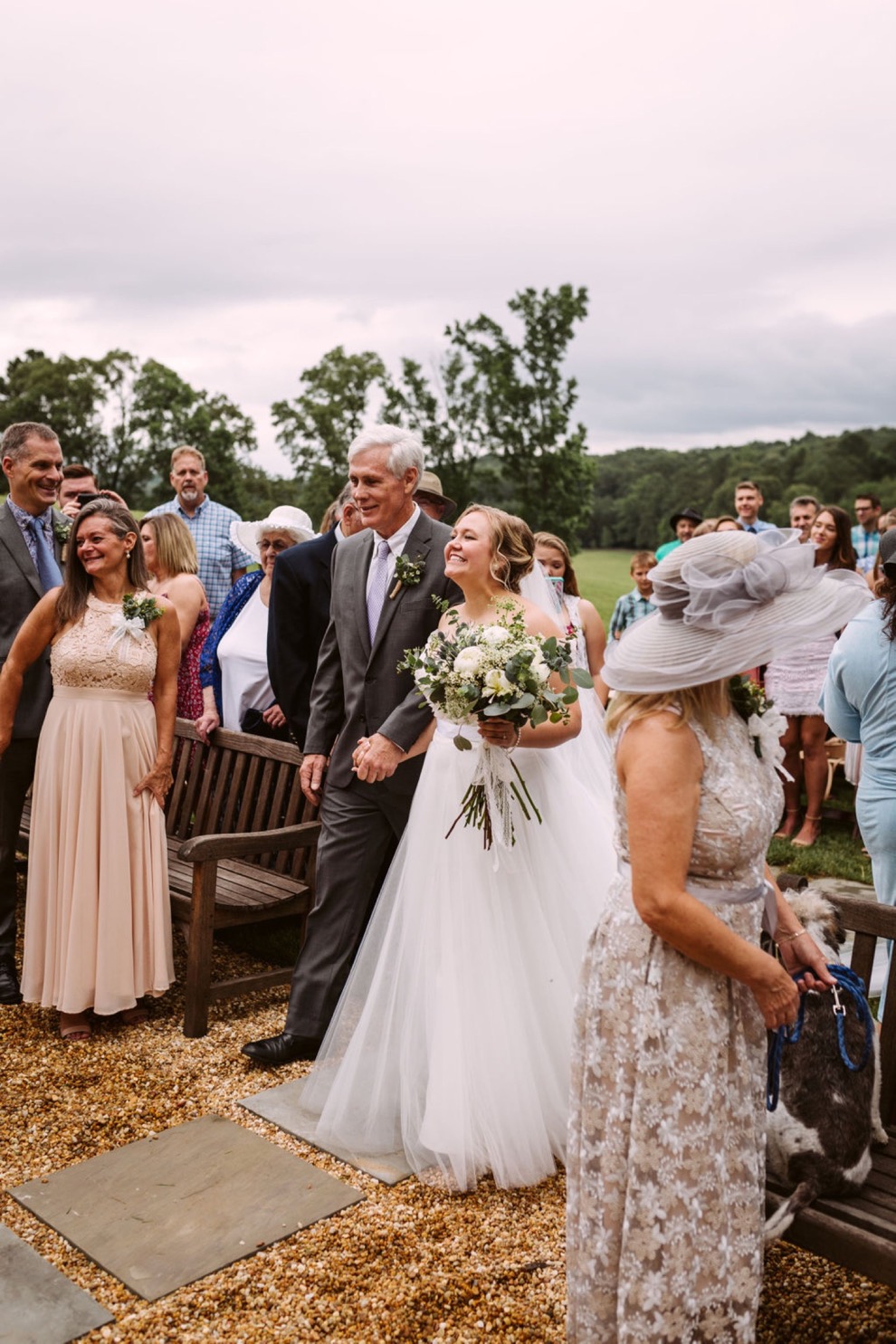 bride walking down aisle during Georgia backyard wedding