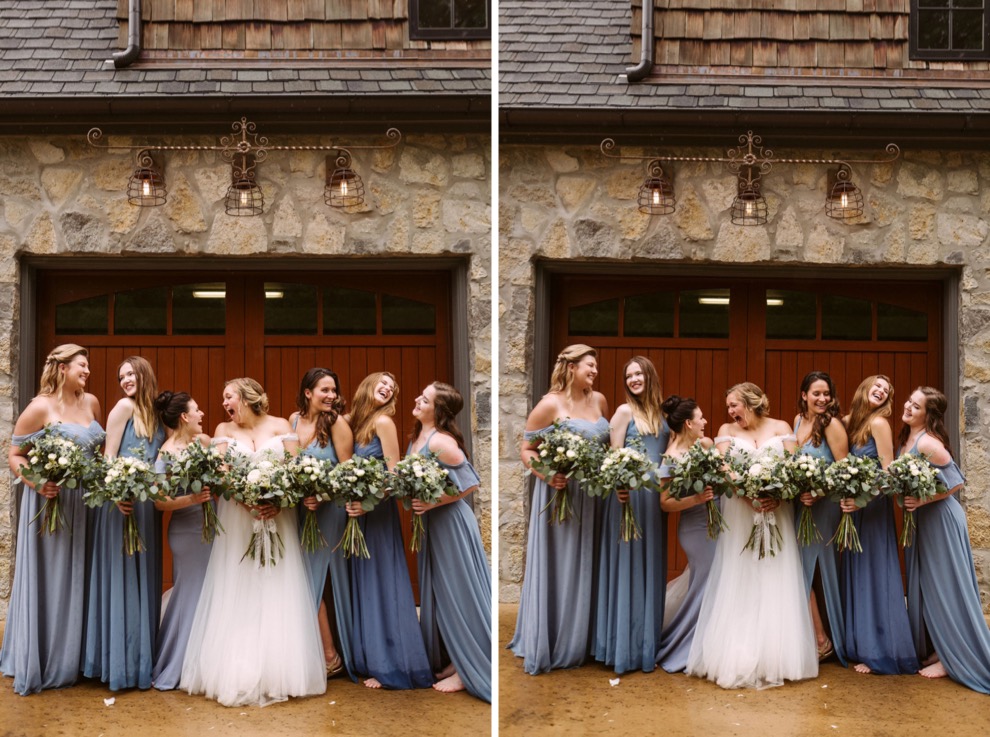 bride with bridesmaids laughing together in front of wide wooden garage door