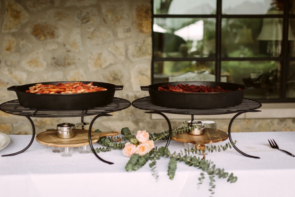 bacon and eggs in warming dishes for backyard brunch wedding