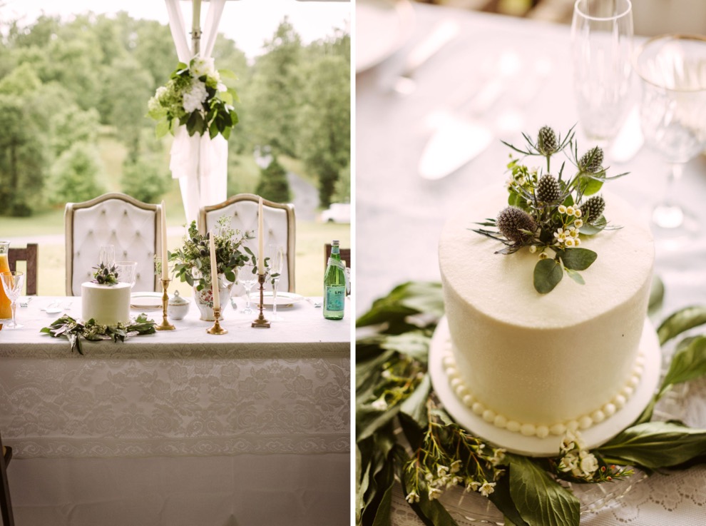 simple round white cake sitting among greenery on a lace-covered table at a Southern backyard wedding