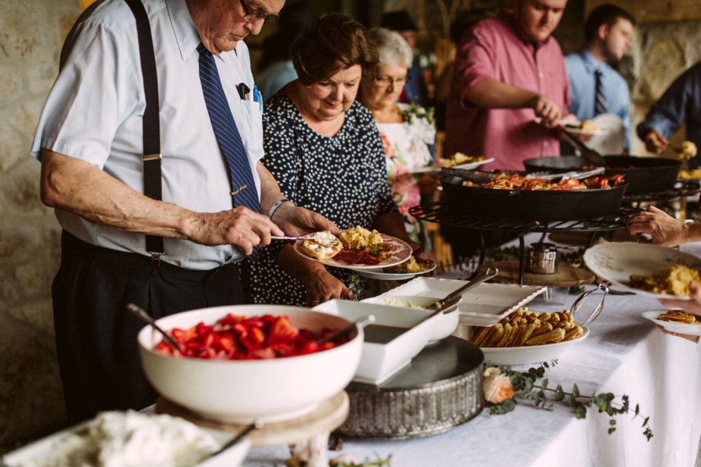 guests serving themselves buffet style brunch at backyard wedding in Calhoun, Georgia