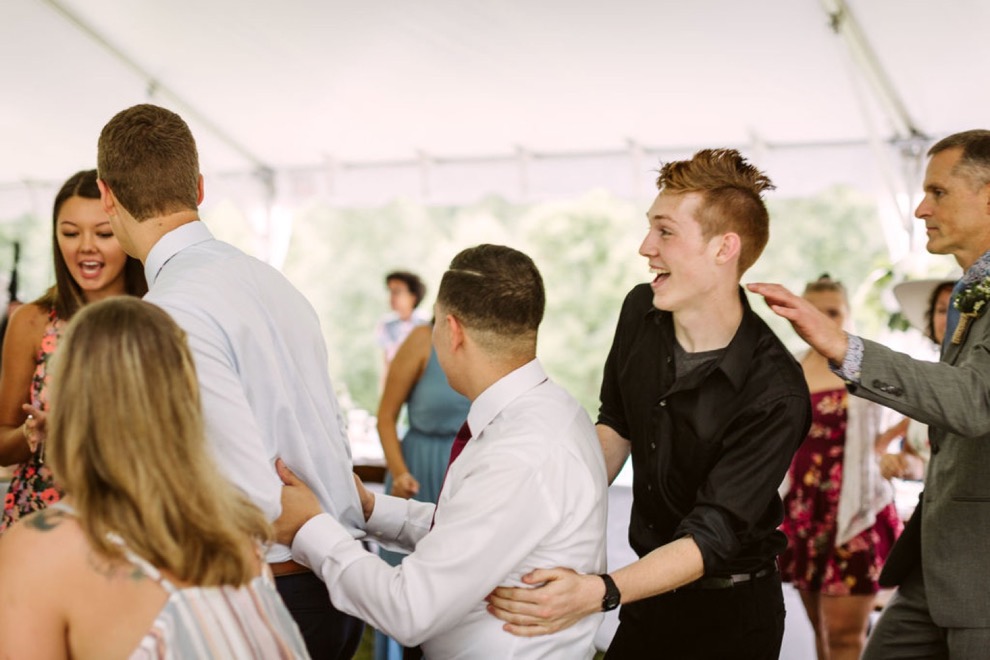 guests dancing at backyard wedding