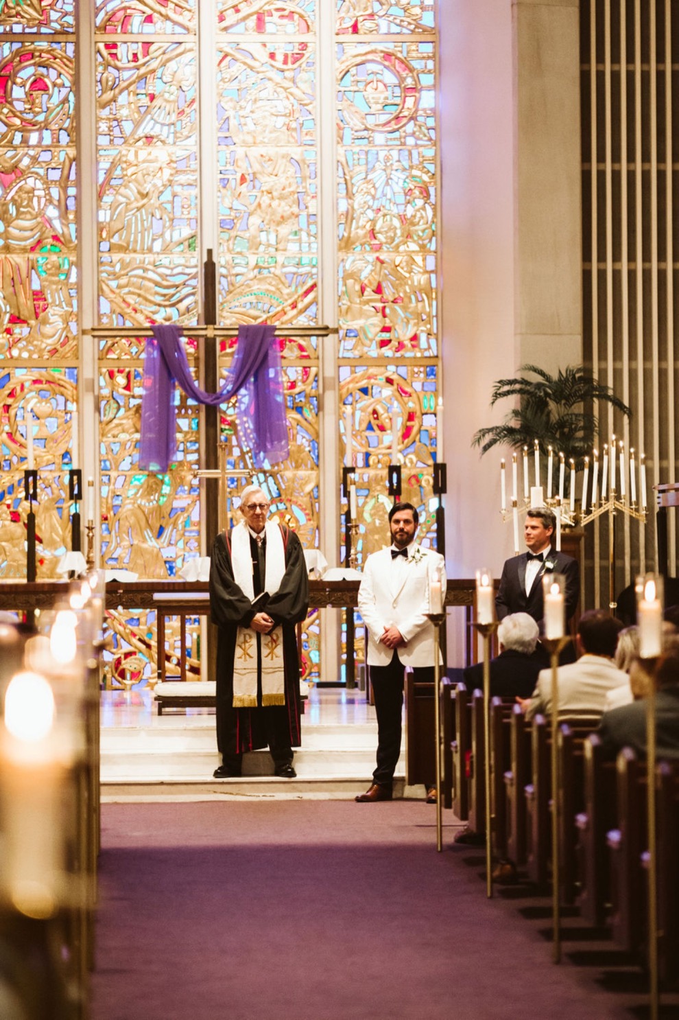 groom waiting at altar for bride during church ceremony