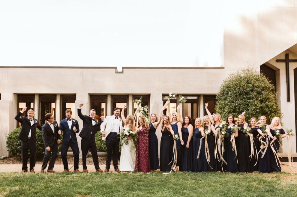 bride and groom with large bridal party