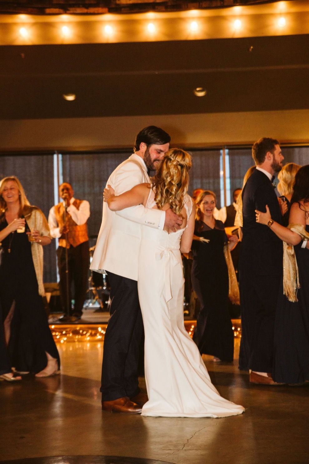 bride and groom first dance during indoor reception