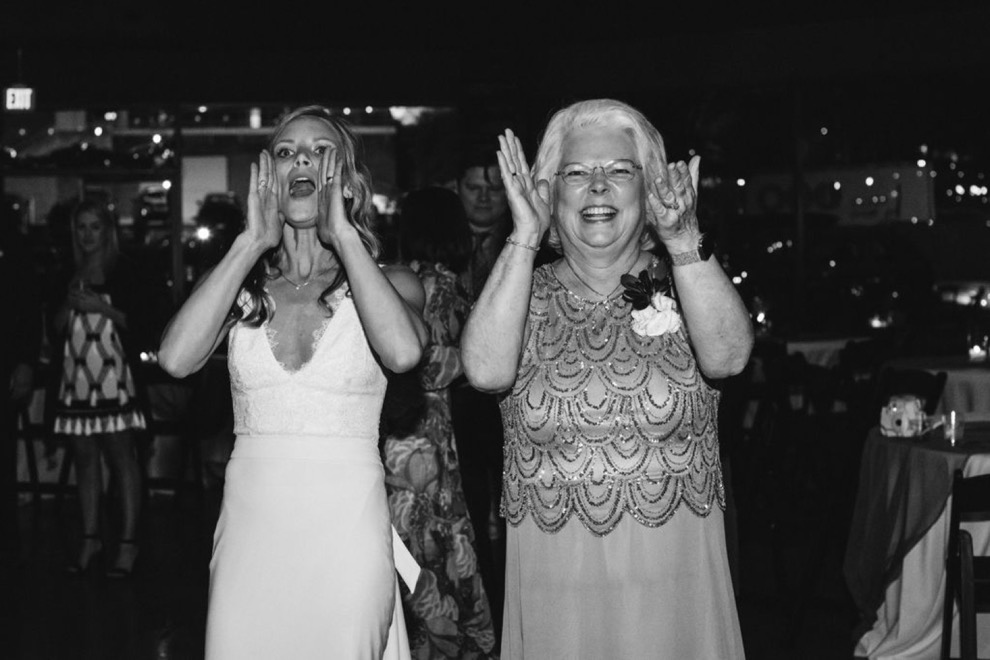 bride calling out to guests at wedding reception