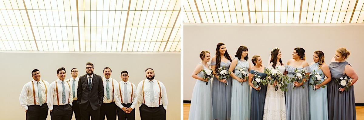Bride laughing with bridesmaids. They wear various shads of blue and hold white and green bouquets under a skylight.
