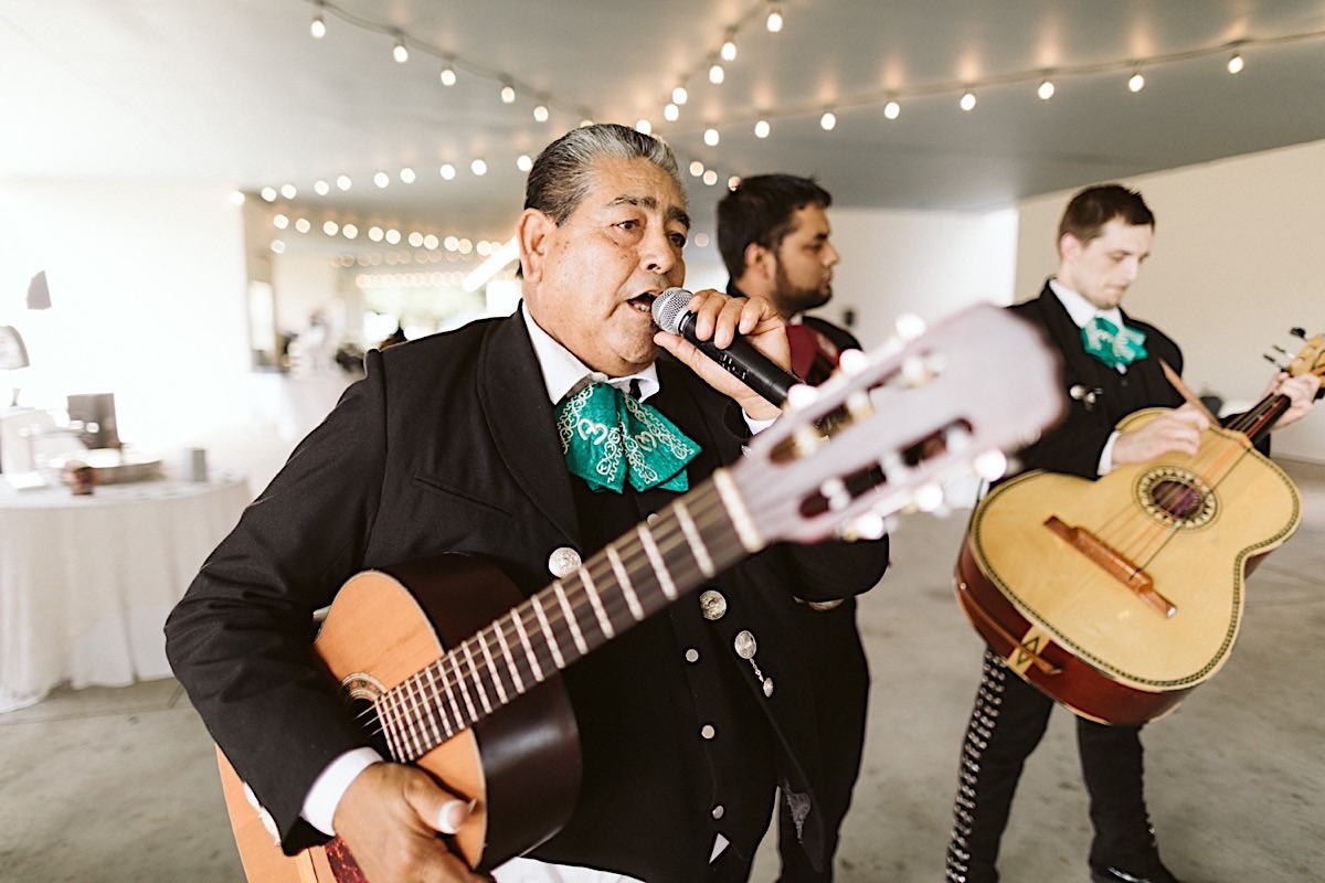 Mariachi band plays and sings table-side for guests during Creative Arts Guild wedding reception in Dalton, Georgia