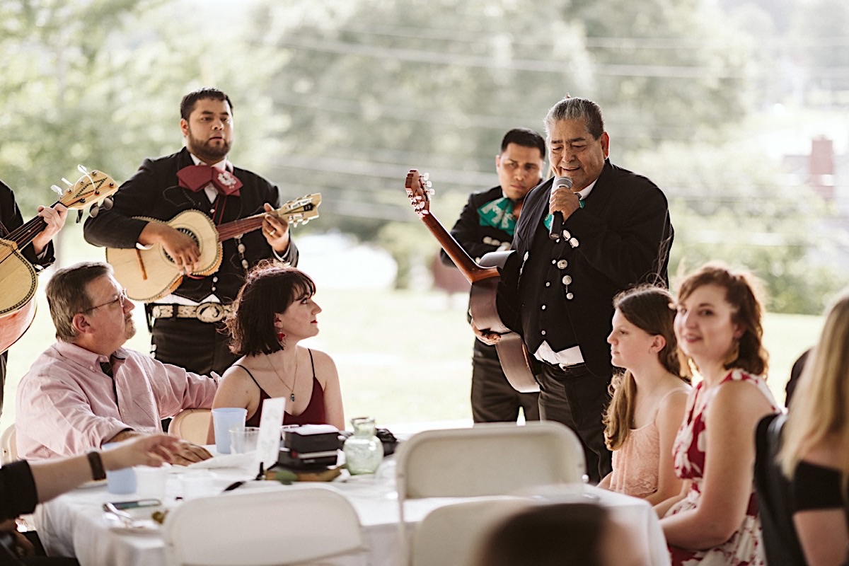 Mariachi band plays and sings table-side for guests during Creative Arts Guild wedding reception in Dalton, Georgia