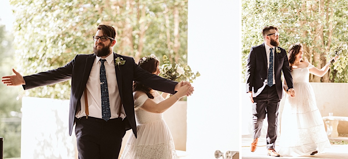 Bride and groom enter their reception as husband and white, his arms outstretched to the guests