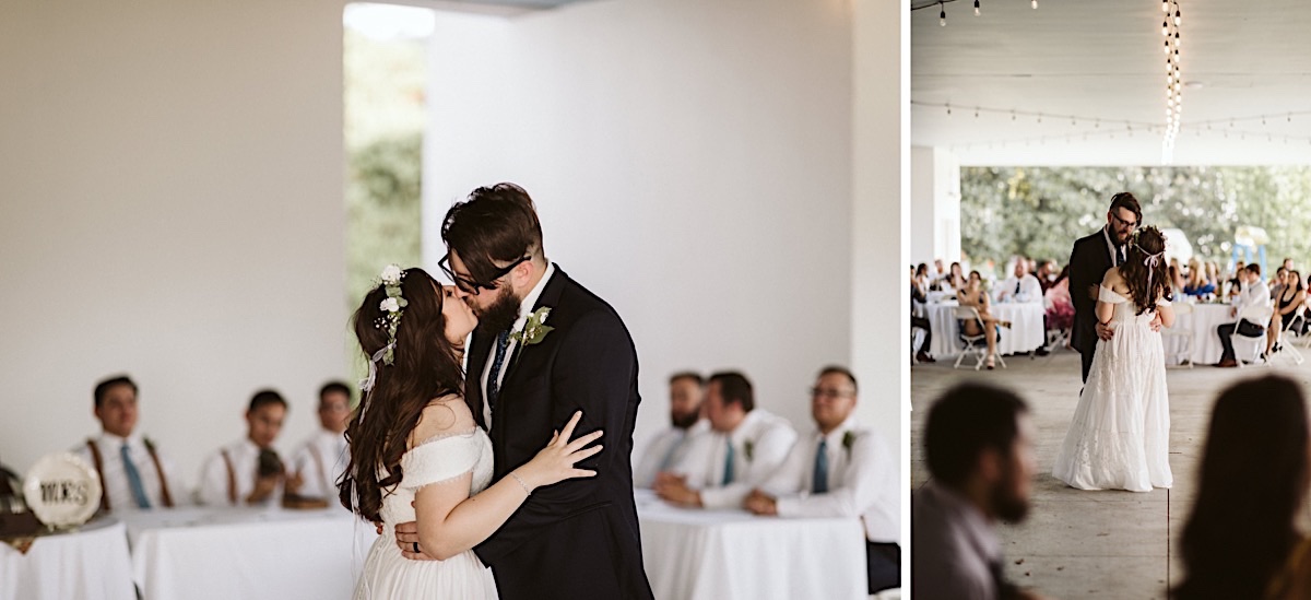 Husband and wife kiss during first dance at their outdoor Creative Arts Guild wedding reception in Dalton, Georgia.