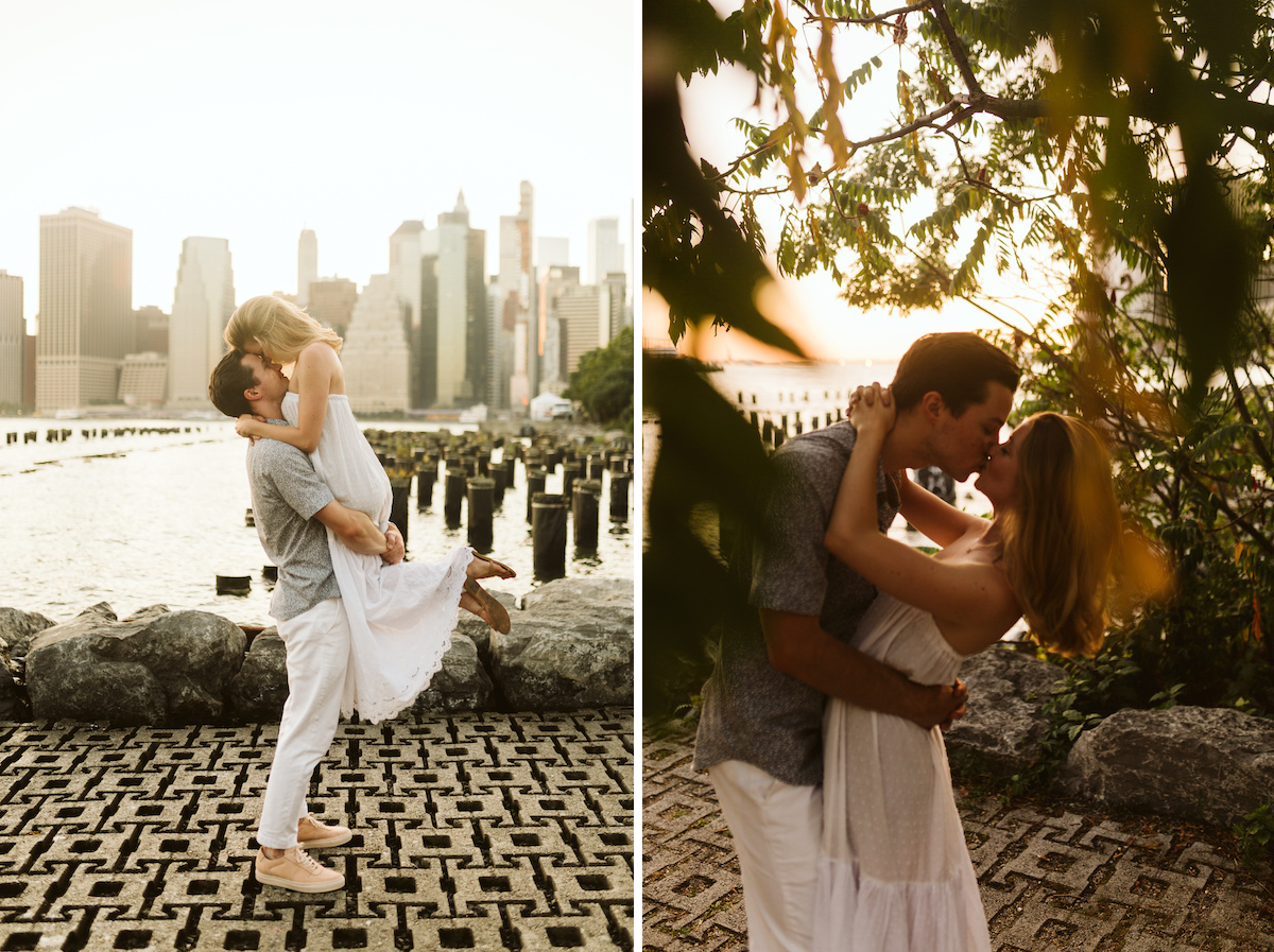Man holds woman in white sundress near water with New York City buildings in the background