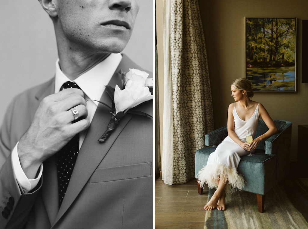 man straightens polka dot tie knot while woman sits in feather-fringed slip in blue chair in front of floor to ceiling window