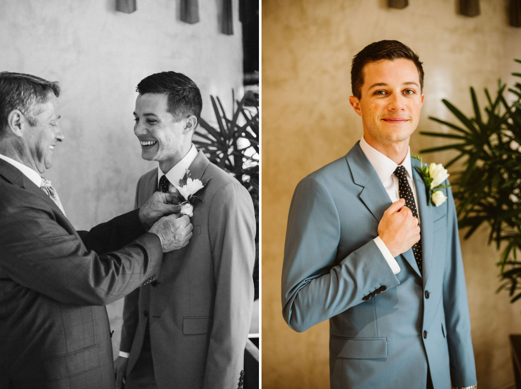 Father pinning boutonnière to groom's jacket and groom standing with right hand on lapel