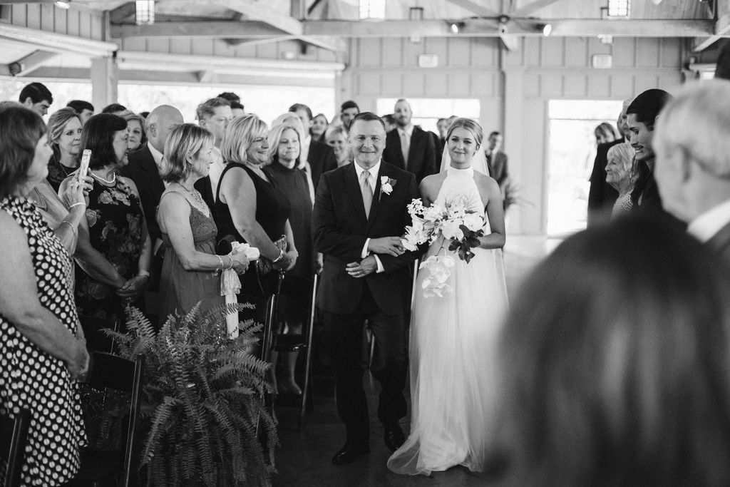 Bride and her father walking down the aisle toward groom during Lookout Mountain Chattanooga, Tennessee wedding ceremony