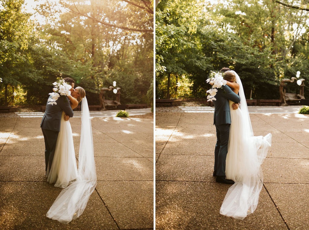 Bride and groom hug after their wedding, her heel kicked up behind her