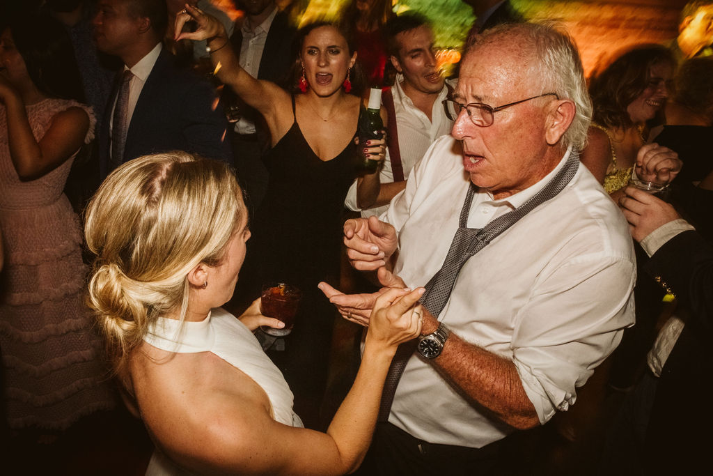 Bride and wedding guest sing to each other