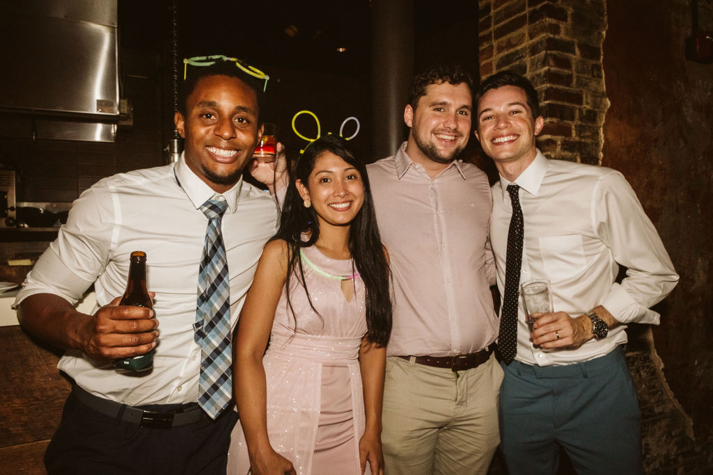 Groom and friends stand together during Chattanooga wedding reception