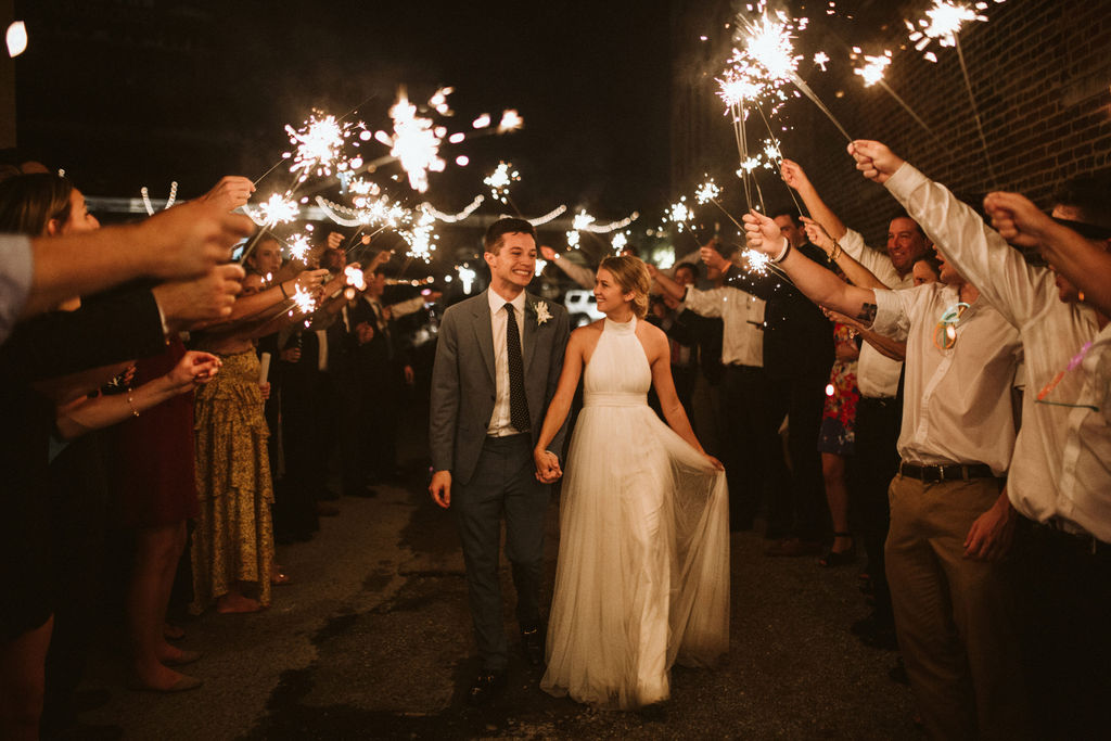 Bride and groom walk through sparkler send-off at the end of their downtown Chattanooga wedding reception