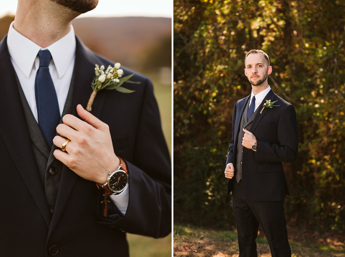 Groom wears a dark suit over a gray vest, navy tie and white shirt. He holds his lapel and his watch peeks out of his sleeve.