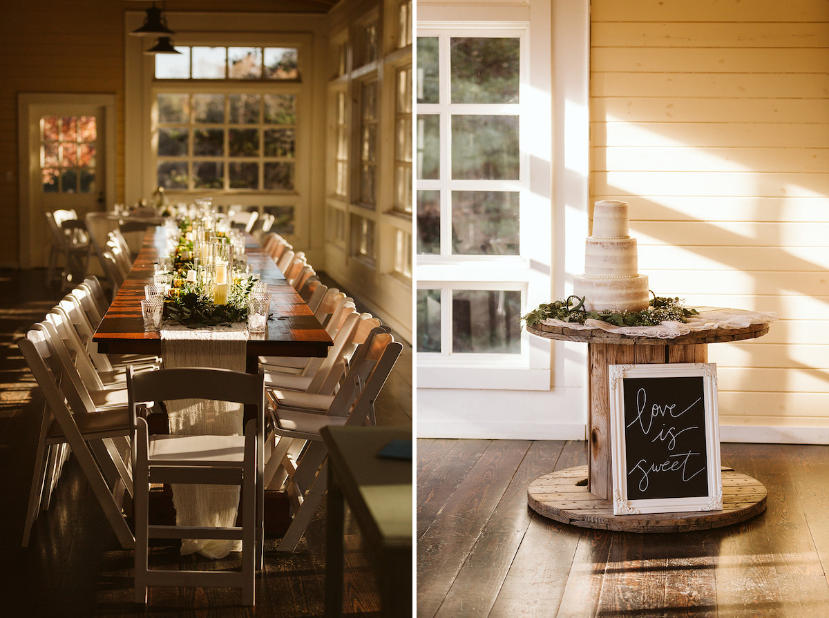 Long farmhouse table lined with white chairs in front of wall of windows. Naked white cake sits on large wooden spool.