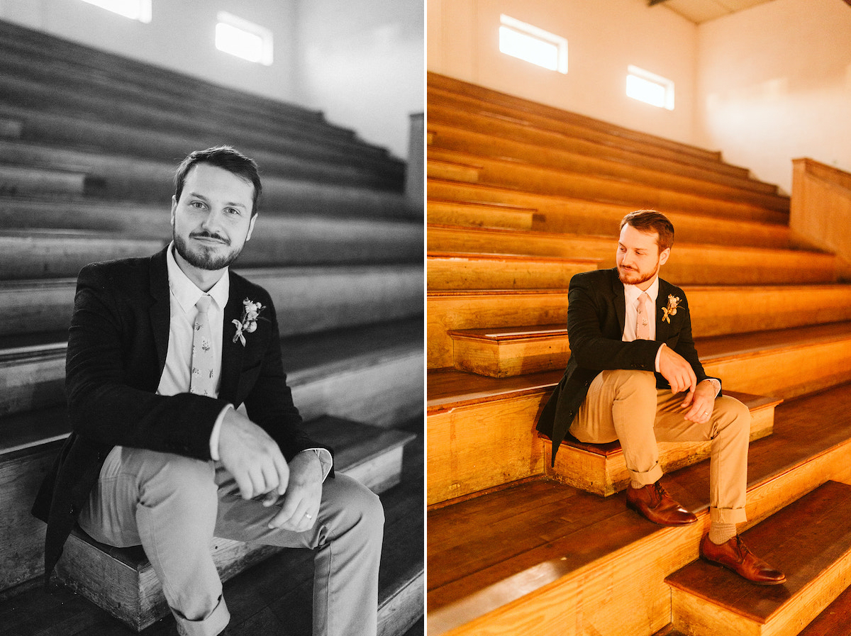 Man in khakis and sport coat sits on wooden bleachers