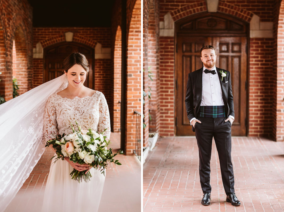 Bride in lace wedding dress looks at bouquet of white and peach flowers; groom wears plaid cummerbund under his tuxedo jacket