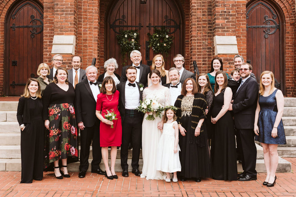 Family photo with bride and groom in front of the doors of St. Paul's Episcopal Church wedding in downtown Chattanooga