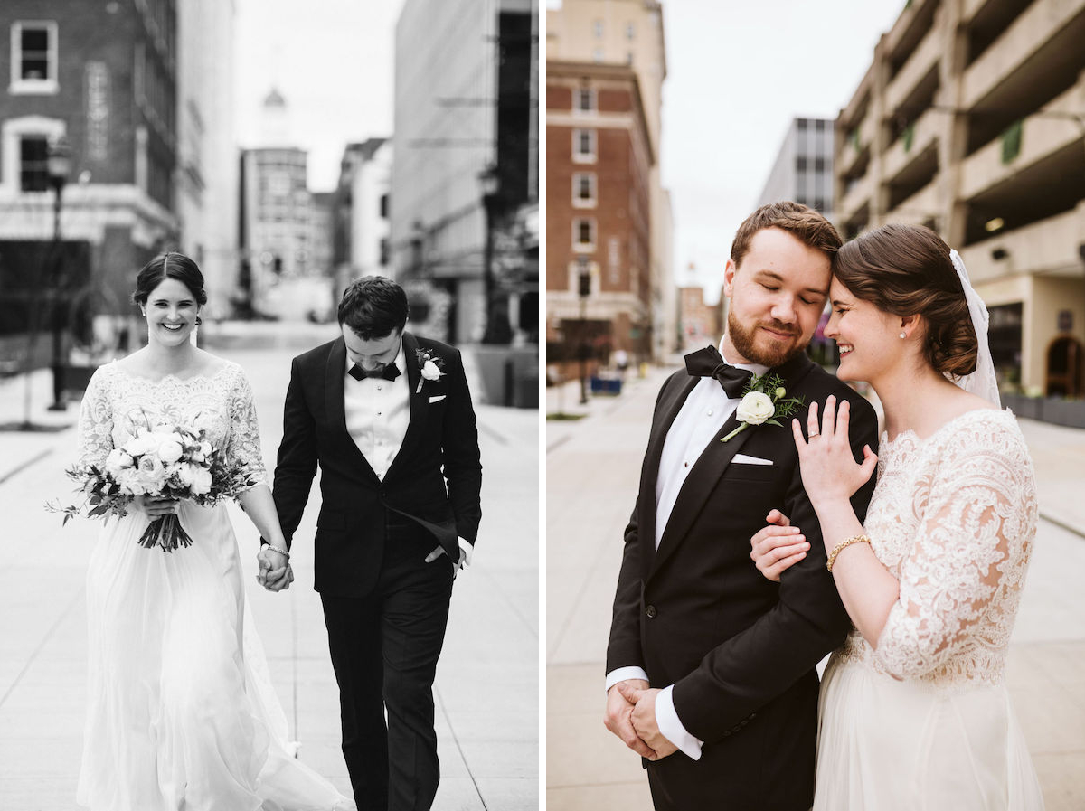 Bride and groom hold hands in Chattanooga's West Village. She holds a bouquet of white and peach flowers