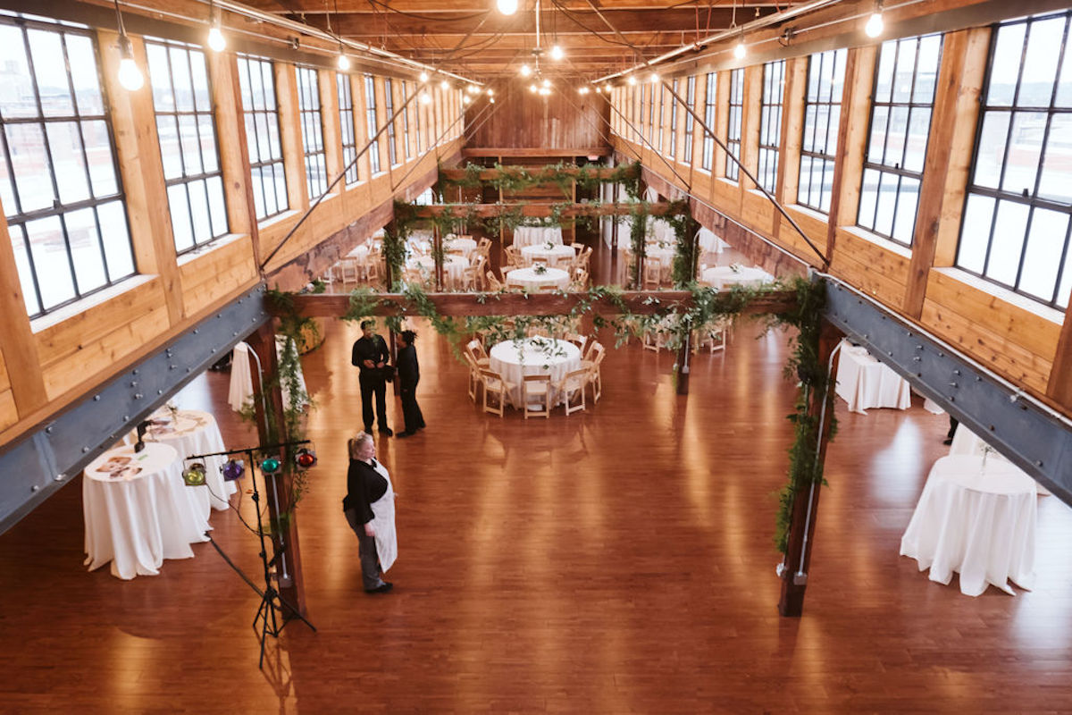 The Turnbull Building's wedding hall with wood finishes, exposed beams, and large windows