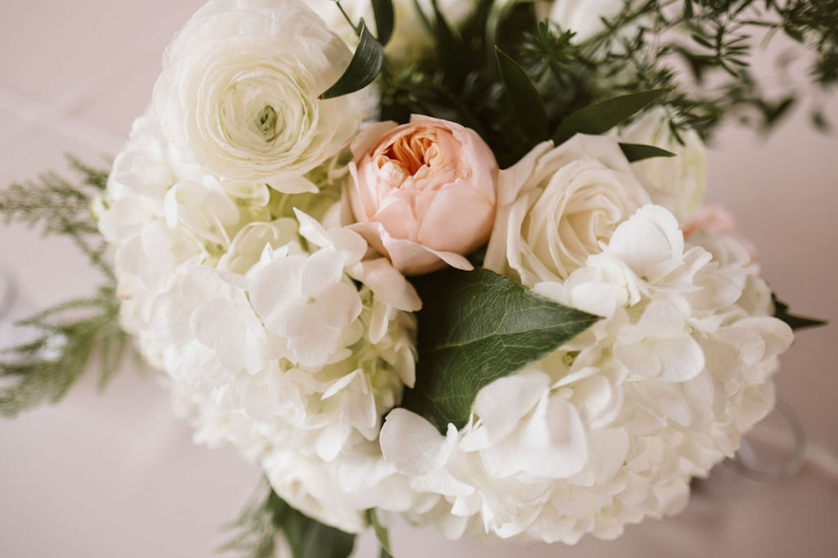 Bouquet of white hydrangeas, peonies, roses and pink peony with greenery