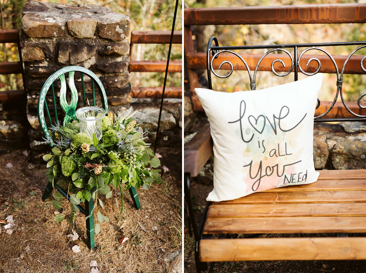 Love is all you need printed pillow on a wooden bench