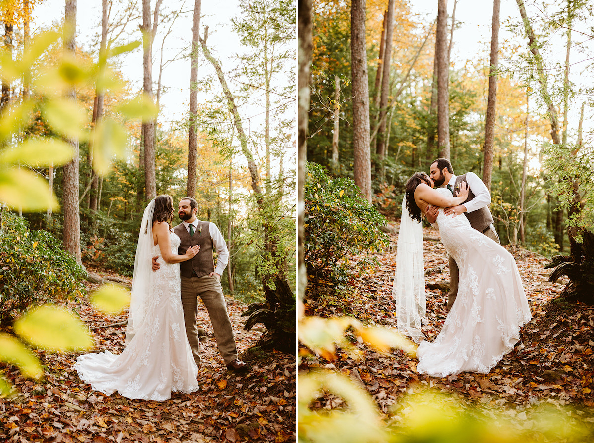groom dips bride for a kiss on a leaf-covered trail under tall trees with colorful leaves