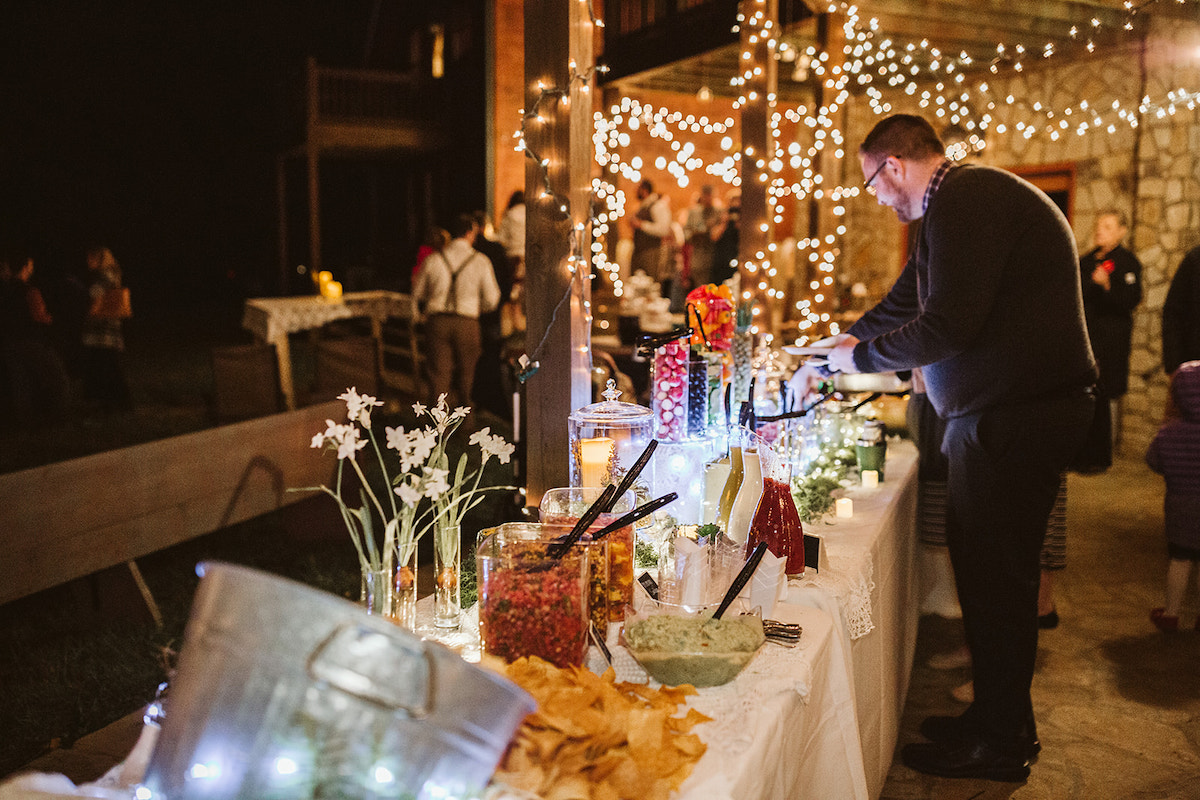 buffet chips and salsa line tables under string porch lights