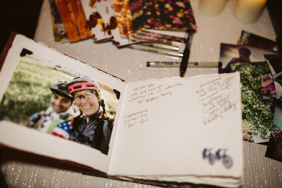 Guestbook with photos of the bride and groom in biking gear