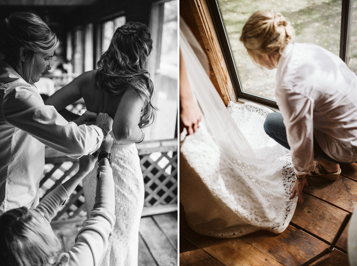 Women help fasten bride's dress and straighten her hemline