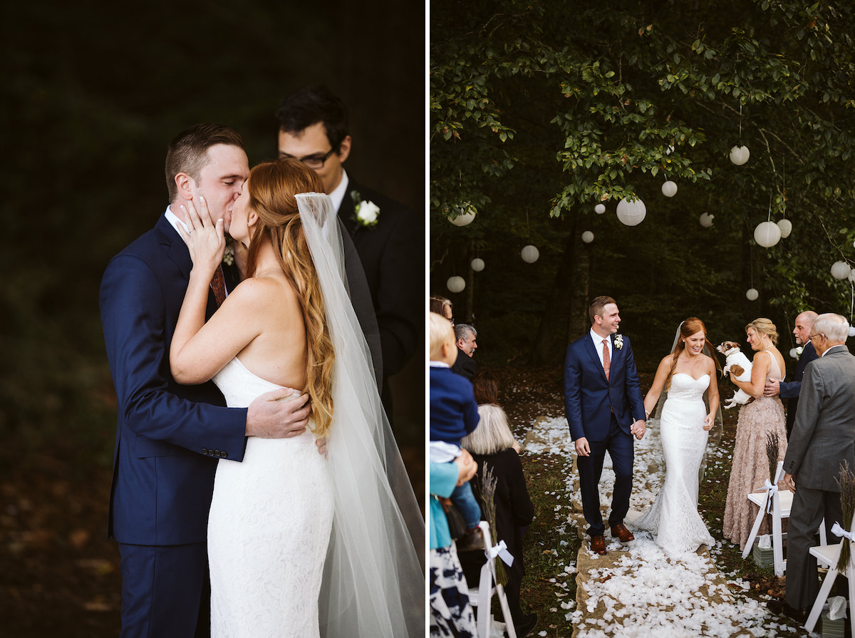 bride and groom walk between white folding chairs, holding hands. A large tree strung with white paper lanterns is behind them.