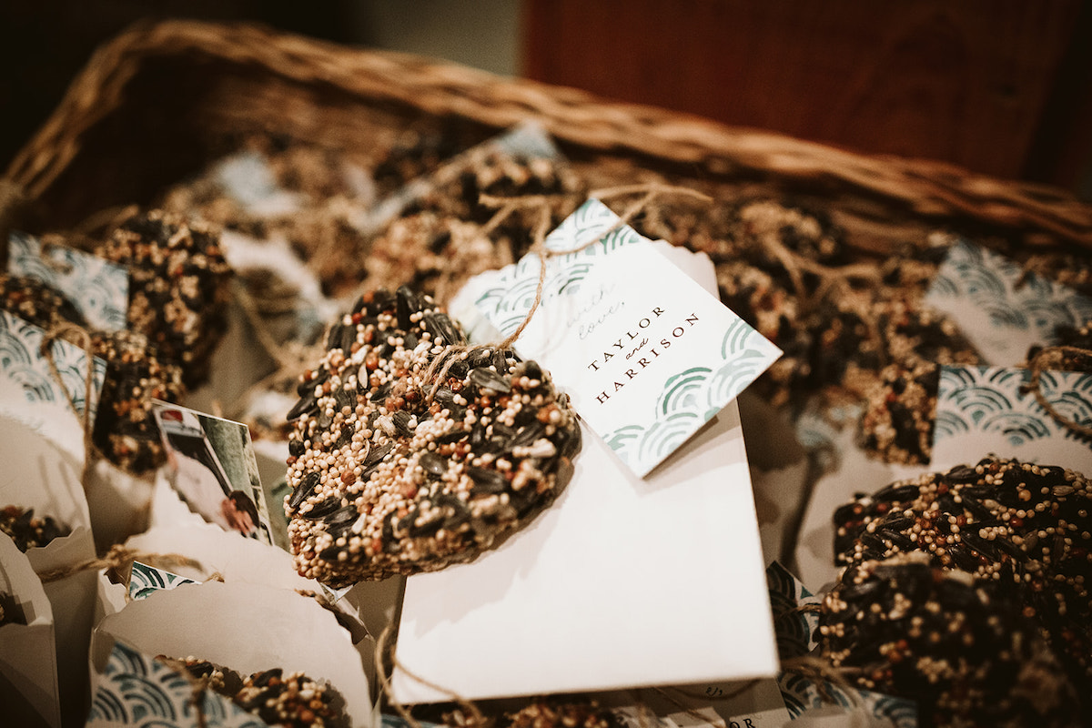 birdseed hearts in a basket with bride and groom gift tags attached