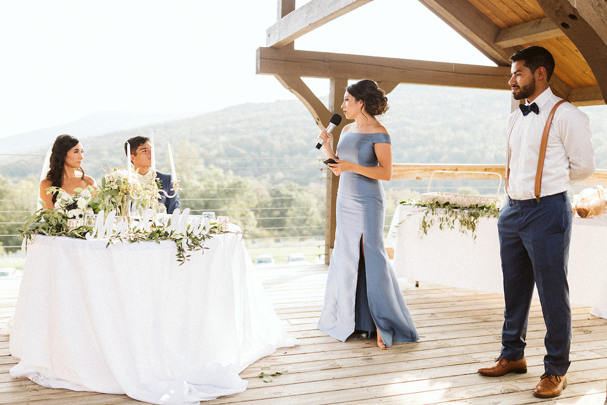 matron of honor and best man give toasts to the bride and groom