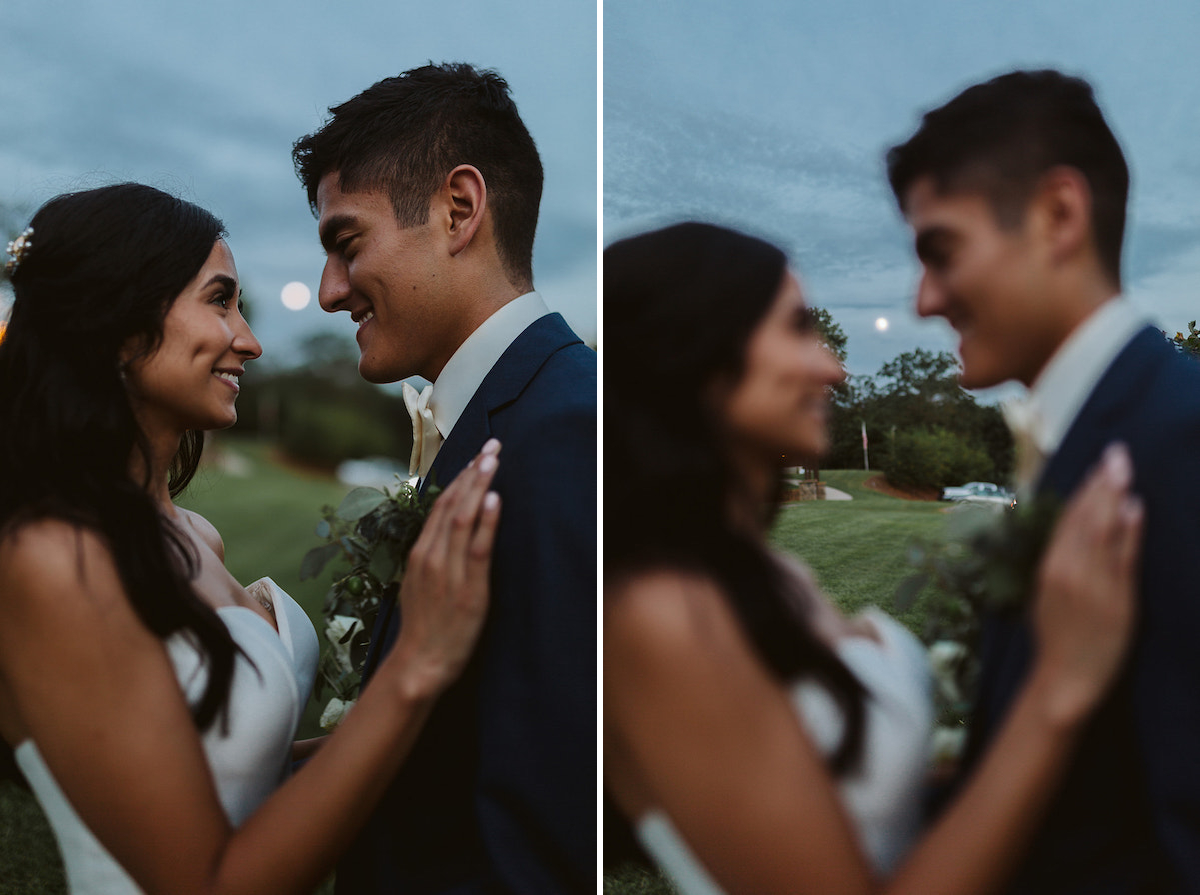 bride places her hand on grooms chest and they smile at each other with the full moon rising behind them