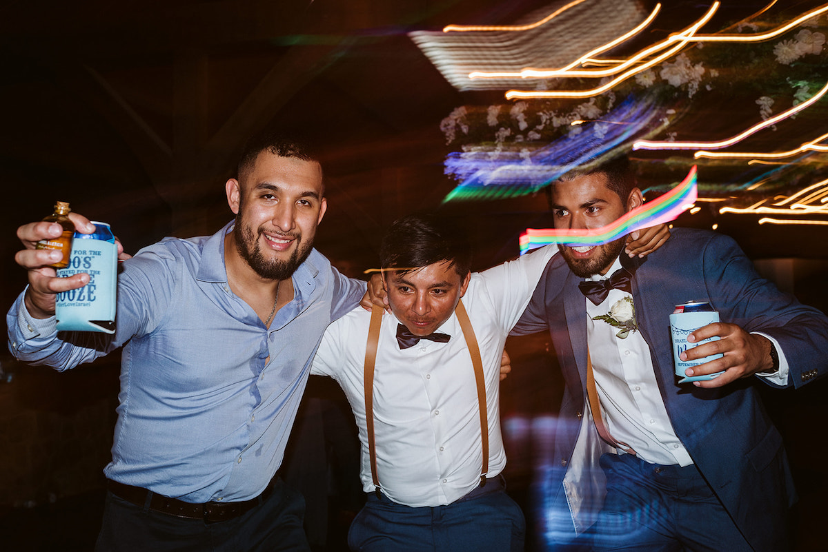 groomsmen and friends dancing together during wedding reception at Debarge Vineyard