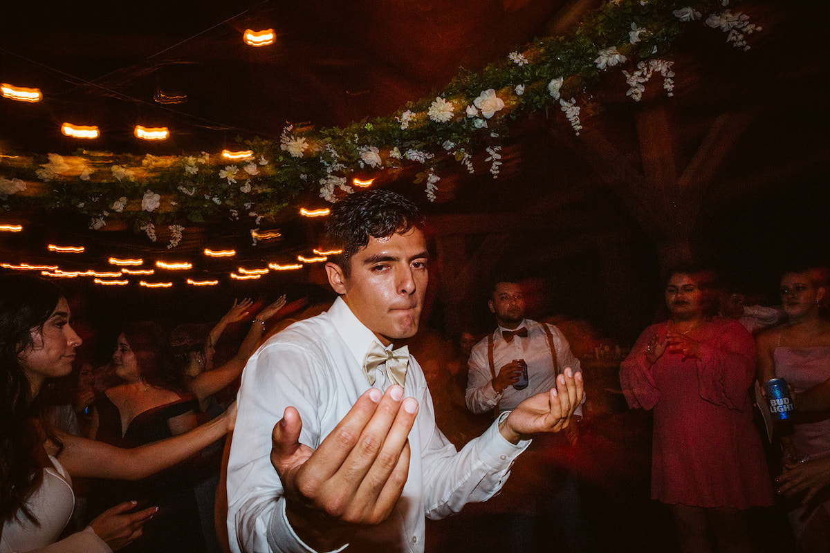 groom dances with friends