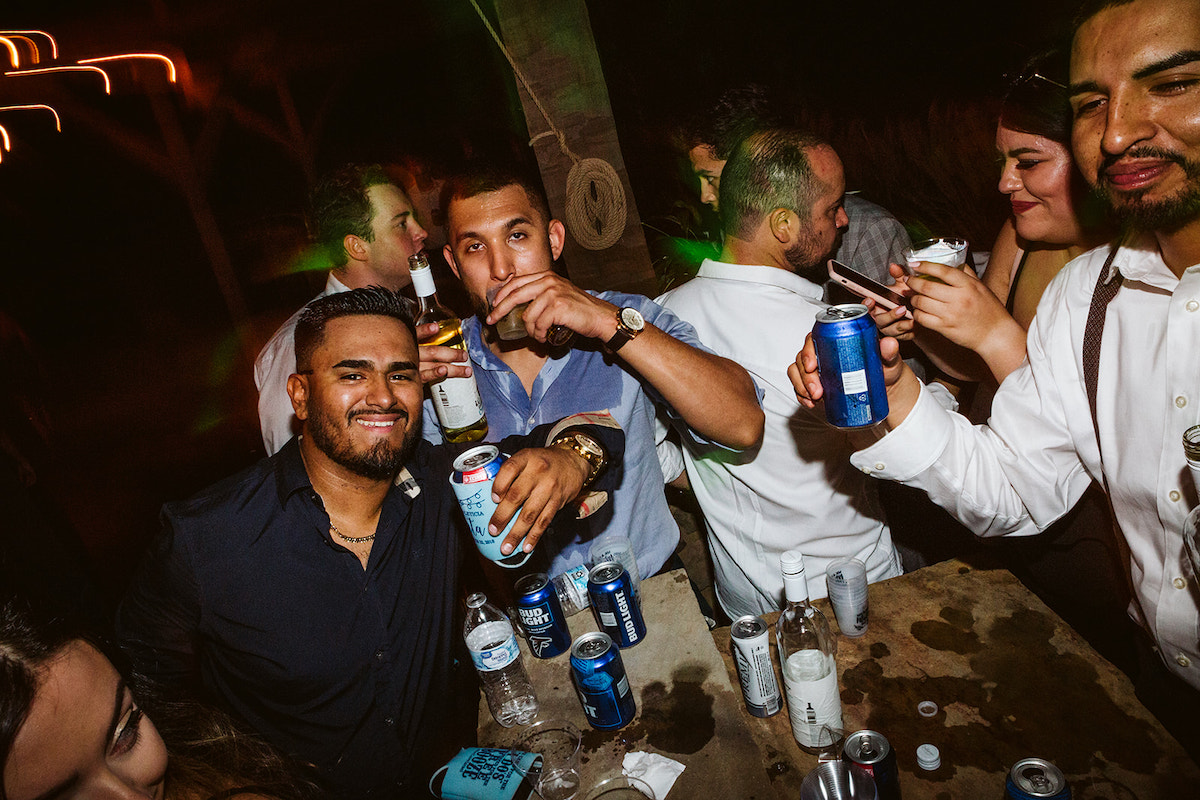 wedding guests take drinks during wedding reception